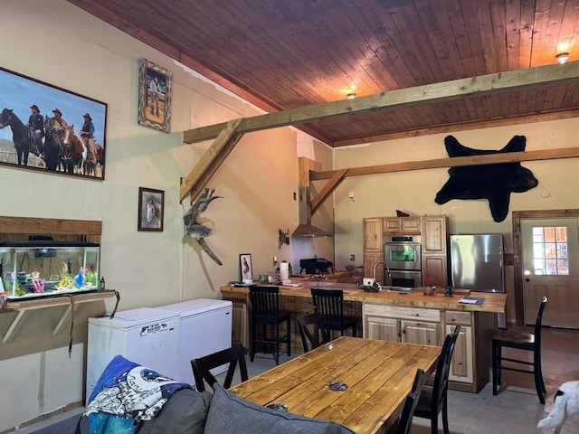 377056 E 1040th Rd, Okemah, OK 74859 - dining space featuring concrete floors, wood ceiling, and beamed ceiling