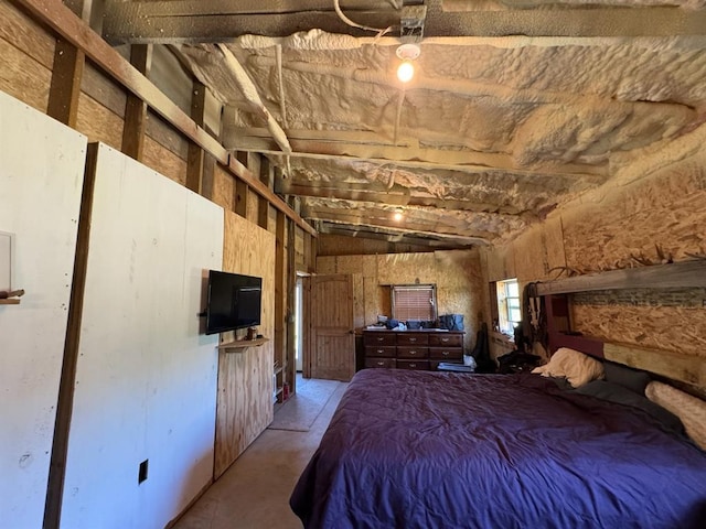 377056 E 1040th Rd, Okemah, OK 74859 - bedroom featuring unfinished concrete flooring and vaulted ceiling