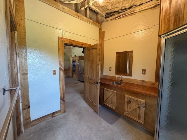377056 E 1040th Rd, Okemah, OK 74859 - bathroom featuring unfinished concrete floors and vanity