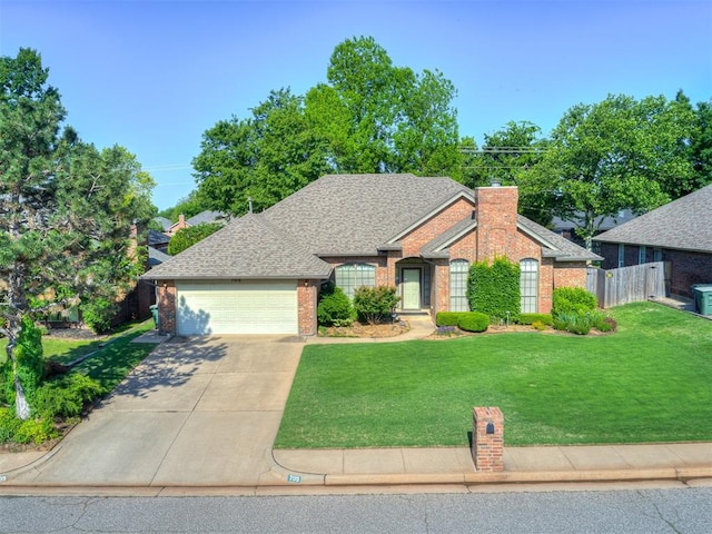 view of front facade featuring brick siding, an attached garage, driveway, a chimney, and roof with shingles