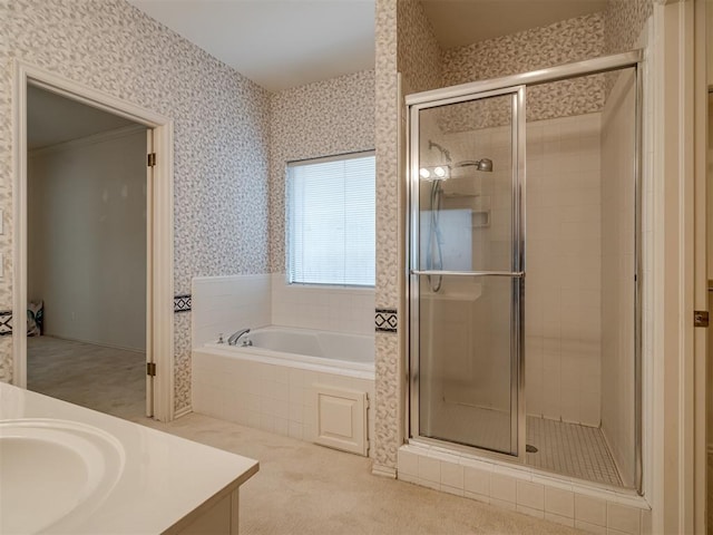 full bath with wallpapered walls, a shower stall, a garden tub, and vanity