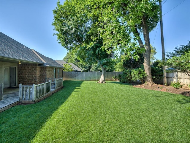 view of yard featuring a deck