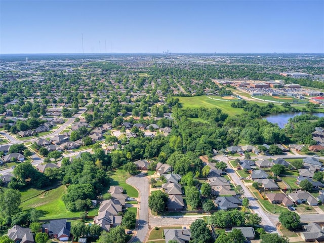 view of property location with nearby suburban area and a large body of water