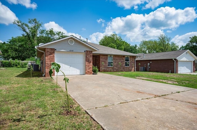 ranch-style house featuring concrete driveway, a front lawn, and brick siding