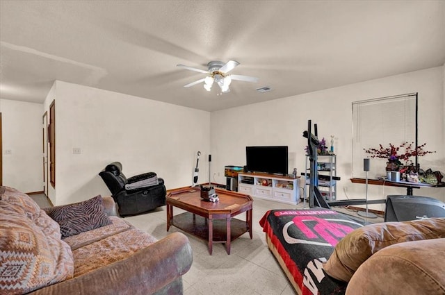 living area with a ceiling fan