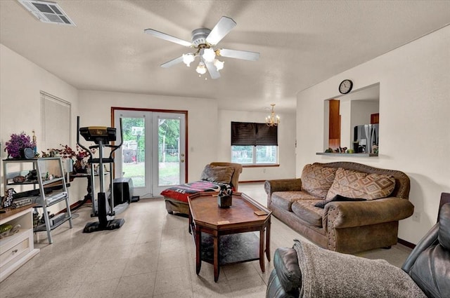 living area featuring a chandelier and ceiling fan