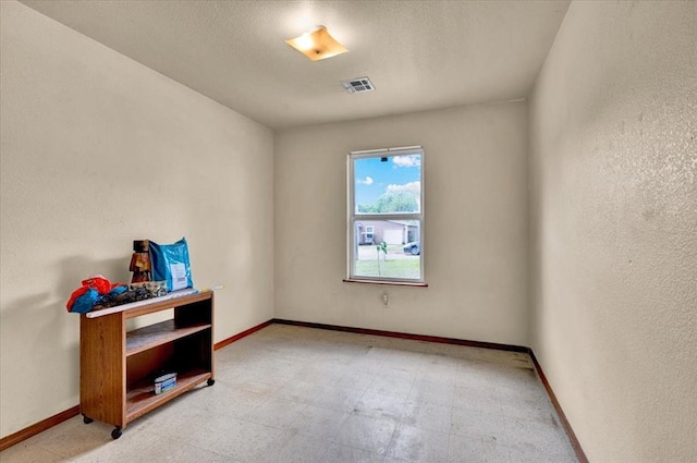 empty room with baseboards and light flooring
