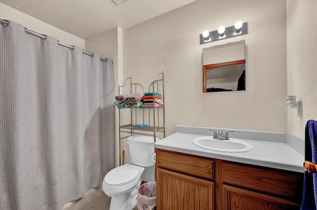 full bathroom with toilet, vanity, and a shower with curtain