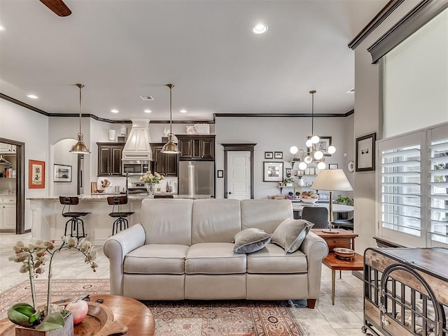 living room featuring ornamental molding, light tile patterned flooring, and recessed lighting