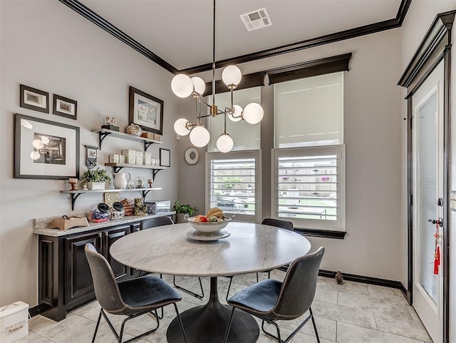 dining room featuring ornamental molding and baseboards