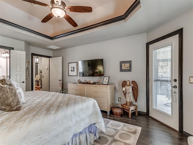 bedroom with dark wood-type flooring, a raised ceiling, baseboards, and ceiling fan