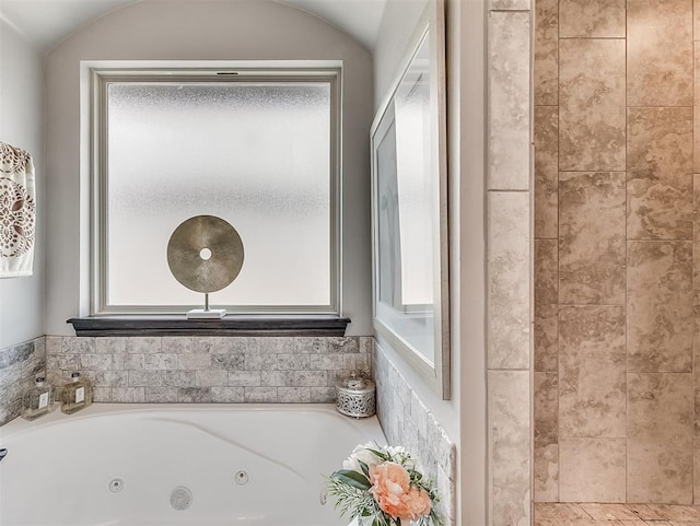 bathroom with a whirlpool tub