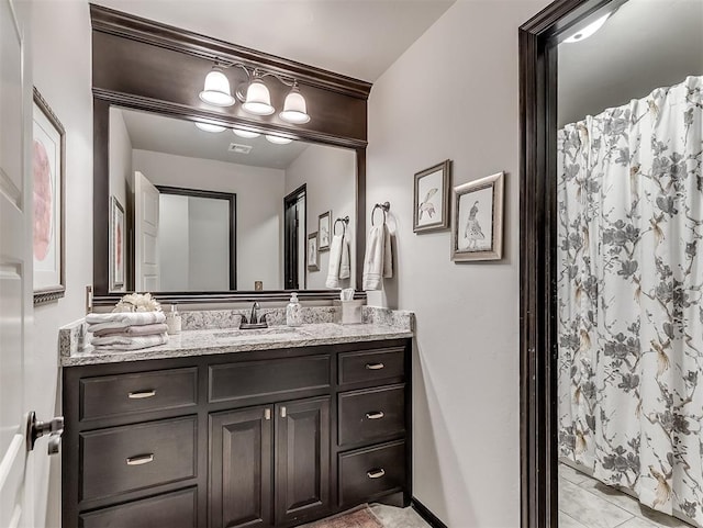 full bath with vanity, curtained shower, and tile patterned floors