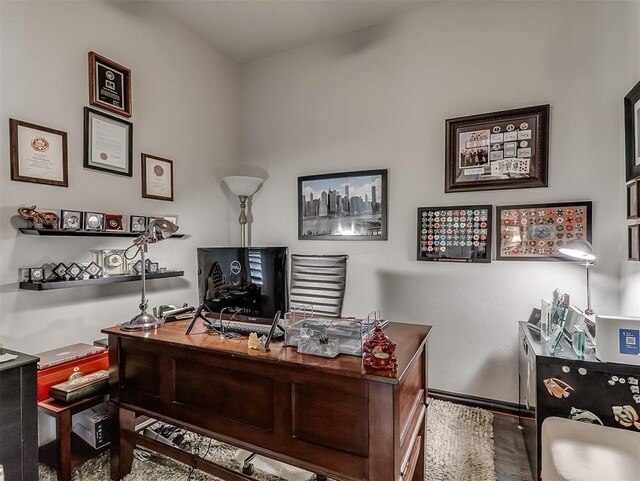 office space featuring wood finished floors and baseboards