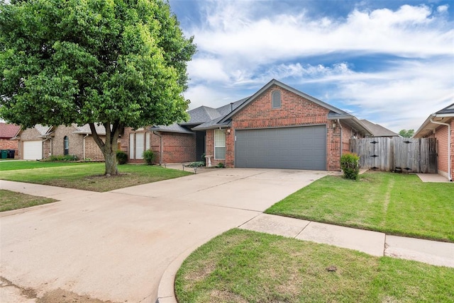 8109 Dawn Cir, Oklahoma City, OK 73135 - view of front of home with brick siding, a garage, concrete driveway, and a gate
