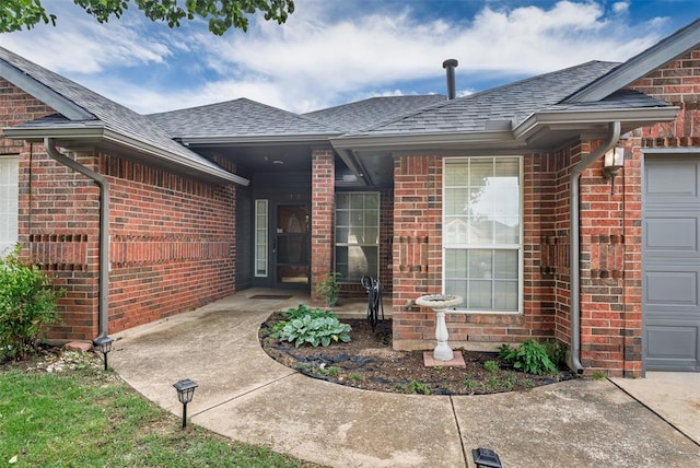 8109 Dawn Cir, Oklahoma City, OK 73135 - view of exterior entry with brick siding and a shingled roof