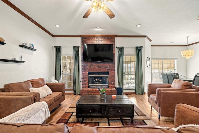 8109 Dawn Cir, Oklahoma City, OK 73135 - living room with wood-type flooring, a ceiling fan, a brick fireplace, ornamental molding, and recessed lighting