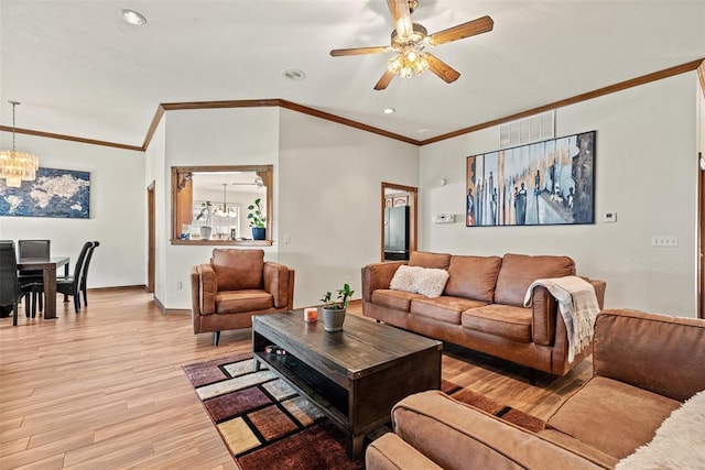 8109 Dawn Cir, Oklahoma City, OK 73135 - living room featuring ceiling fan, light wood finished floors, ornamental molding, recessed lighting, and a chandelier