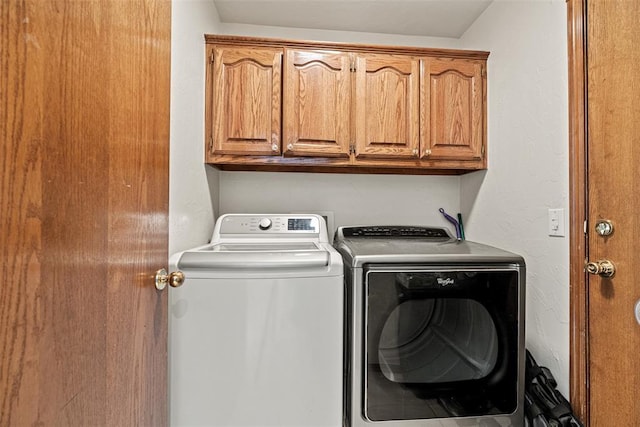 8109 Dawn Cir, Oklahoma City, OK 73135 - clothes washing area featuring separate washer and dryer and cabinet space