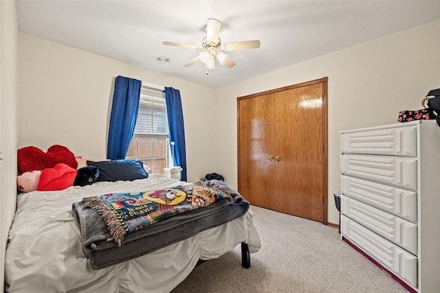 8109 Dawn Cir, Oklahoma City, OK 73135 - bedroom featuring light colored carpet, a ceiling fan, and a closet