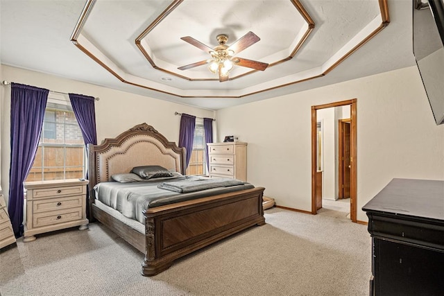 8109 Dawn Cir, Oklahoma City, OK 73135 - bedroom featuring a tray ceiling, light carpet, ceiling fan, and baseboards