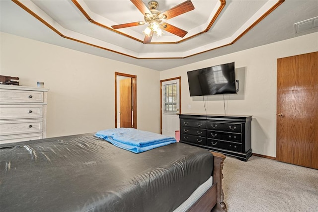 8109 Dawn Cir, Oklahoma City, OK 73135 - bedroom with carpet floors, a tray ceiling, and a ceiling fan