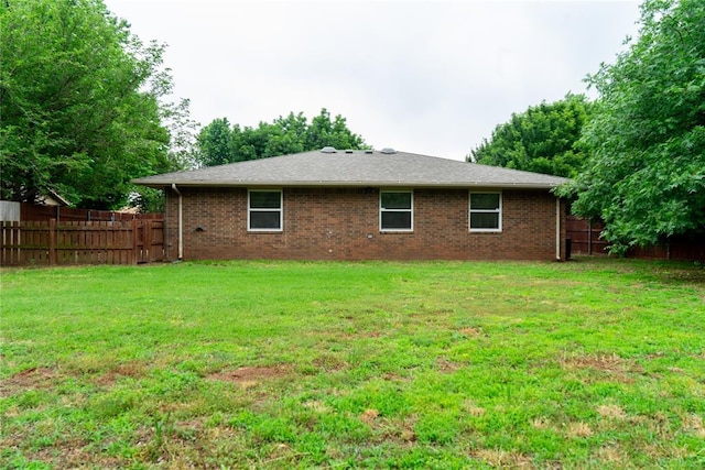 201 Lois Ave, Tuttle, OK 73089 - rear view of property featuring brick siding