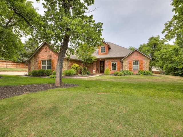 3570 Riverwood Ln, Edmond, OK 73034 - traditional-style home featuring stone siding and brick siding