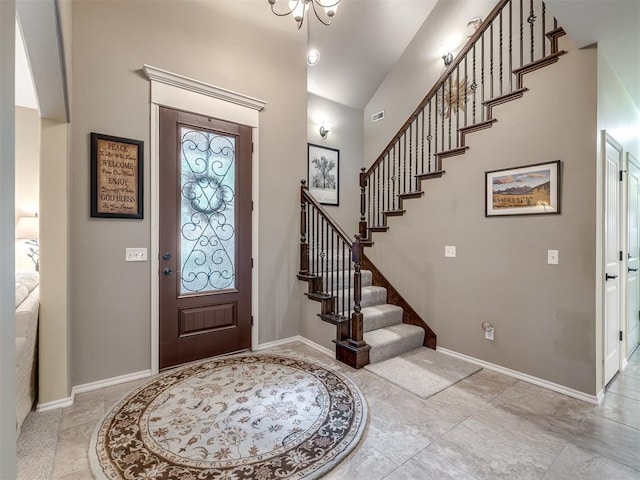 3570 Riverwood Ln, Edmond, OK 73034 - foyer entrance with stairs, baseboards, and vaulted ceiling