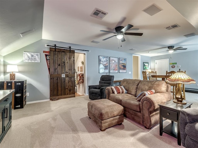 3570 Riverwood Ln, Edmond, OK 73034 - living area featuring ceiling fan, a barn door, light colored carpet, baseboards, and vaulted ceiling