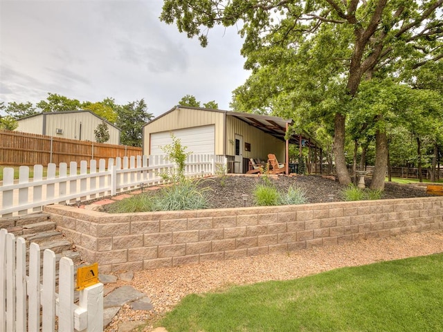 3570 Riverwood Ln, Edmond, OK 73034 - view of yard with fence, a detached garage, and an outdoor structure