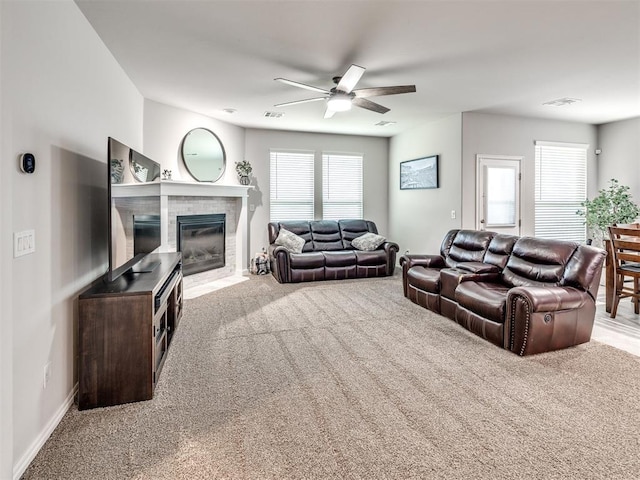 10301 NW 25th St, Yukon, OK 73099 - carpeted living room with ceiling fan, plenty of natural light, a brick fireplace, and baseboards
