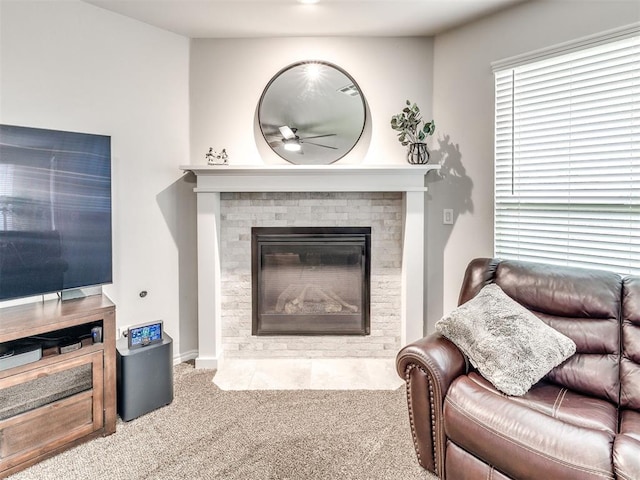 10301 NW 25th St, Yukon, OK 73099 - living area with carpet flooring, a ceiling fan, and a fireplace with flush hearth
