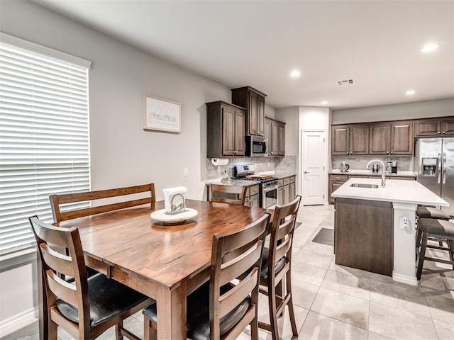 10301 NW 25th St, Yukon, OK 73099 - dining area featuring light tile patterned floors and recessed lighting