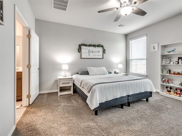 10301 NW 25th St, Yukon, OK 73099 - bedroom with light carpet, baseboards, and ceiling fan