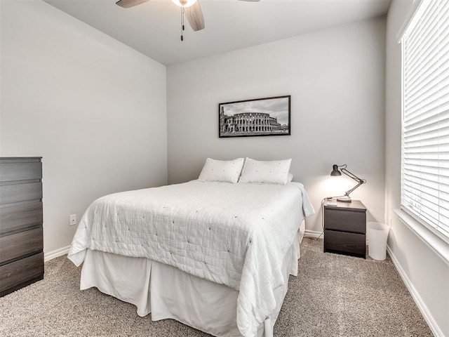 10301 NW 25th St, Yukon, OK 73099 - bedroom with carpet floors, baseboards, and a ceiling fan