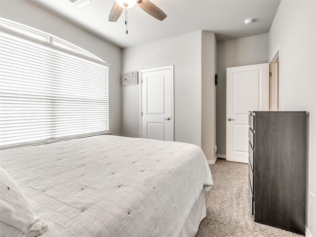 10301 NW 25th St, Yukon, OK 73099 - bedroom featuring light colored carpet, a ceiling fan, and baseboards