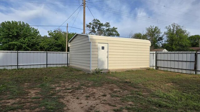 view of shed with a fenced backyard