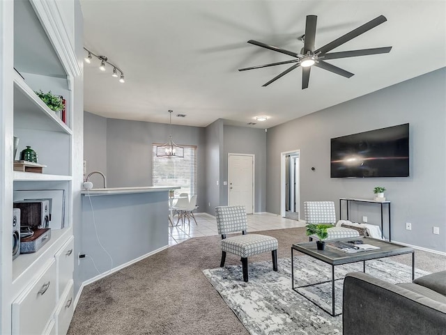 4900 Republic Dr, Oklahoma City, OK 73135 - living area with carpet flooring, ceiling fan, a chandelier, and baseboards