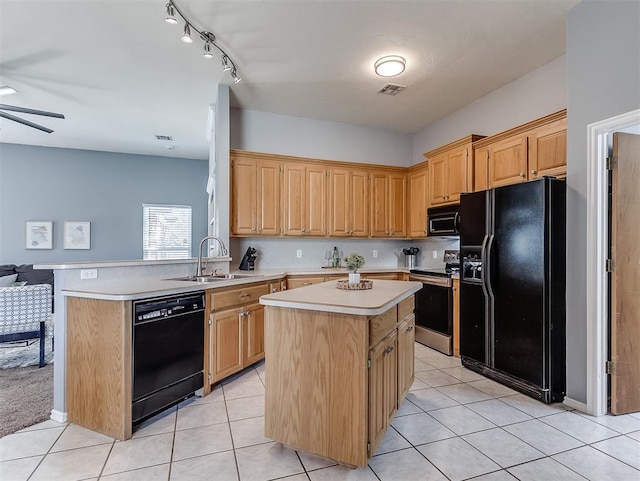 4900 Republic Dr, Oklahoma City, OK 73135 - kitchen with black appliances, a sink, light countertops, a ceiling fan, and a kitchen island