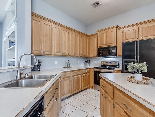 4900 Republic Dr, Oklahoma City, OK 73135 - kitchen with black appliances, a sink, light countertops, and light tile patterned floors