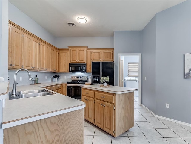4900 Republic Dr, Oklahoma City, OK 73135 - kitchen with black appliances, a sink, washer / clothes dryer, light countertops, and light tile patterned floors