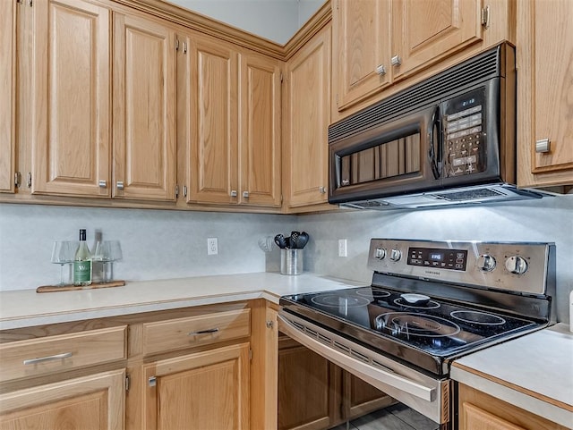 4900 Republic Dr, Oklahoma City, OK 73135 - kitchen with stainless steel electric stove, black microwave, light countertops, and light brown cabinets