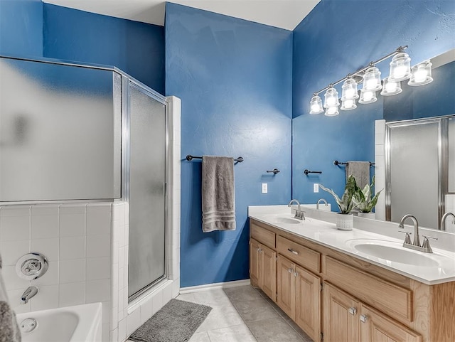 4900 Republic Dr, Oklahoma City, OK 73135 - bathroom with a stall shower, double vanity, a tub to relax in, and tile patterned flooring