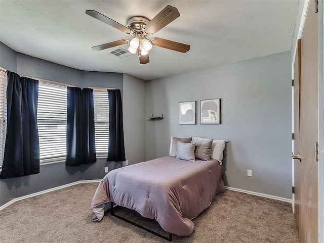 4900 Republic Dr, Oklahoma City, OK 73135 - carpeted bedroom featuring baseboards and a ceiling fan