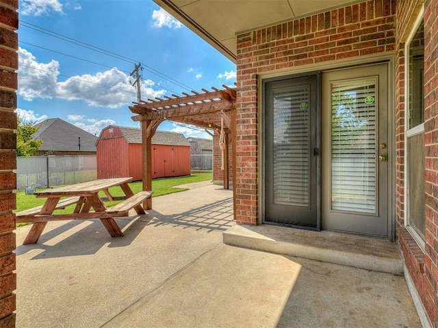 4900 Republic Dr, Oklahoma City, OK 73135 - view of patio / terrace with a shed, a pergola, fence, an outdoor structure, and outdoor dining space