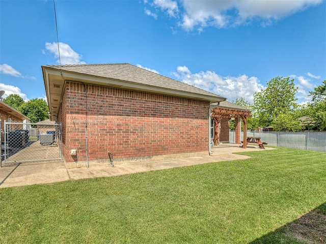 4900 Republic Dr, Oklahoma City, OK 73135 - rear view of house with a patio, brick siding, a pergola, and roof with shingles