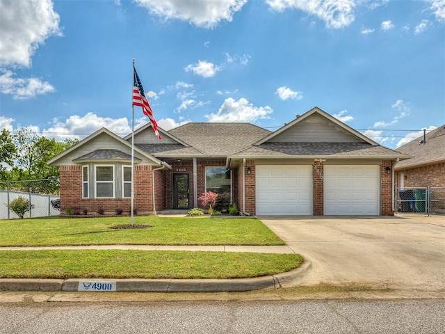 4900 Republic Dr, Oklahoma City, OK 73135 - view of front of house with a garage, brick siding, concrete driveway, and a shingled roof
