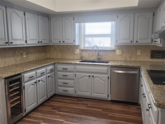 kitchen with stainless steel dishwasher, a sink, beverage cooler, black electric stovetop, and tasteful backsplash