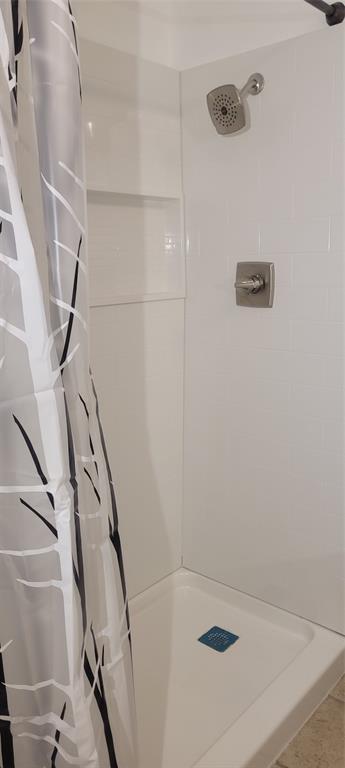 full bathroom with a stall shower